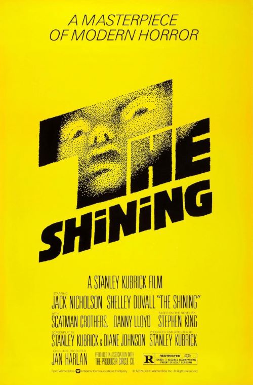 yellow background with 'The Shining' in black block letters, with a haunting face transposed in the letter T.